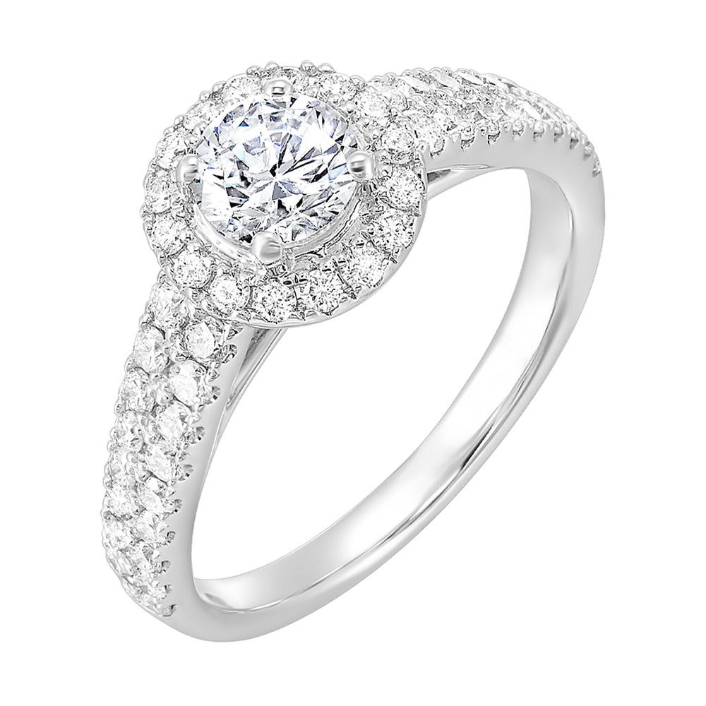 This beautiful engagement ring features pave set diamonds on the halo and a duet of diamonds gracefully embrace the tapered band highlighting the center solitare perfectly.