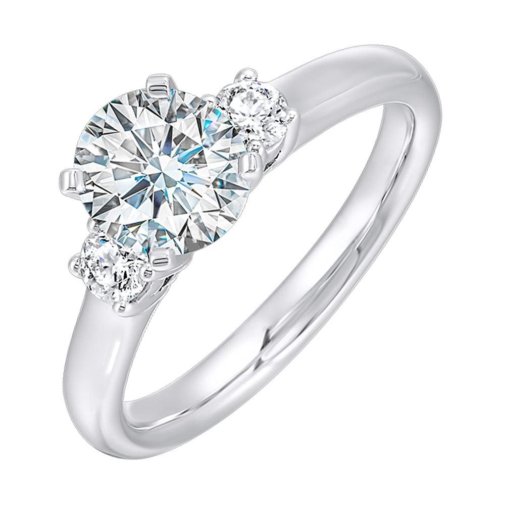 Classic and romantic,  this three stone engagement ring features the bold gold shank to sparkle your moments further.