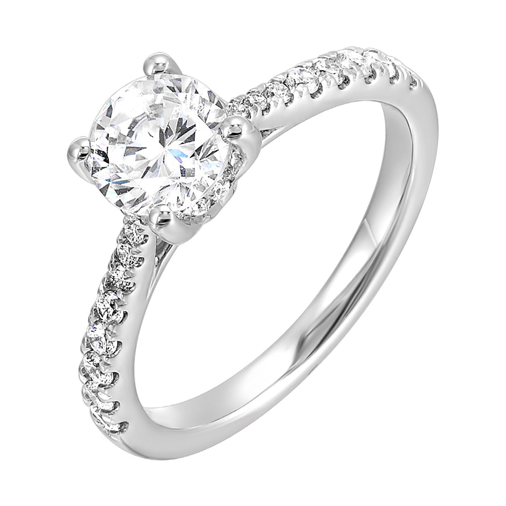 Delicate pave diamonds pinched towards the top add a touch of modern look,  highlighting the solitare even further.