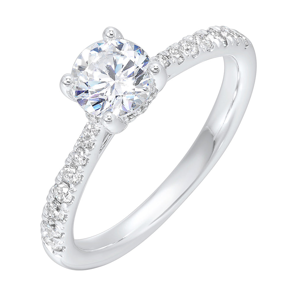 Reverse tapered band on this solitaire engagement ring draws your eye to the sparkling round solitare making it the focal point.