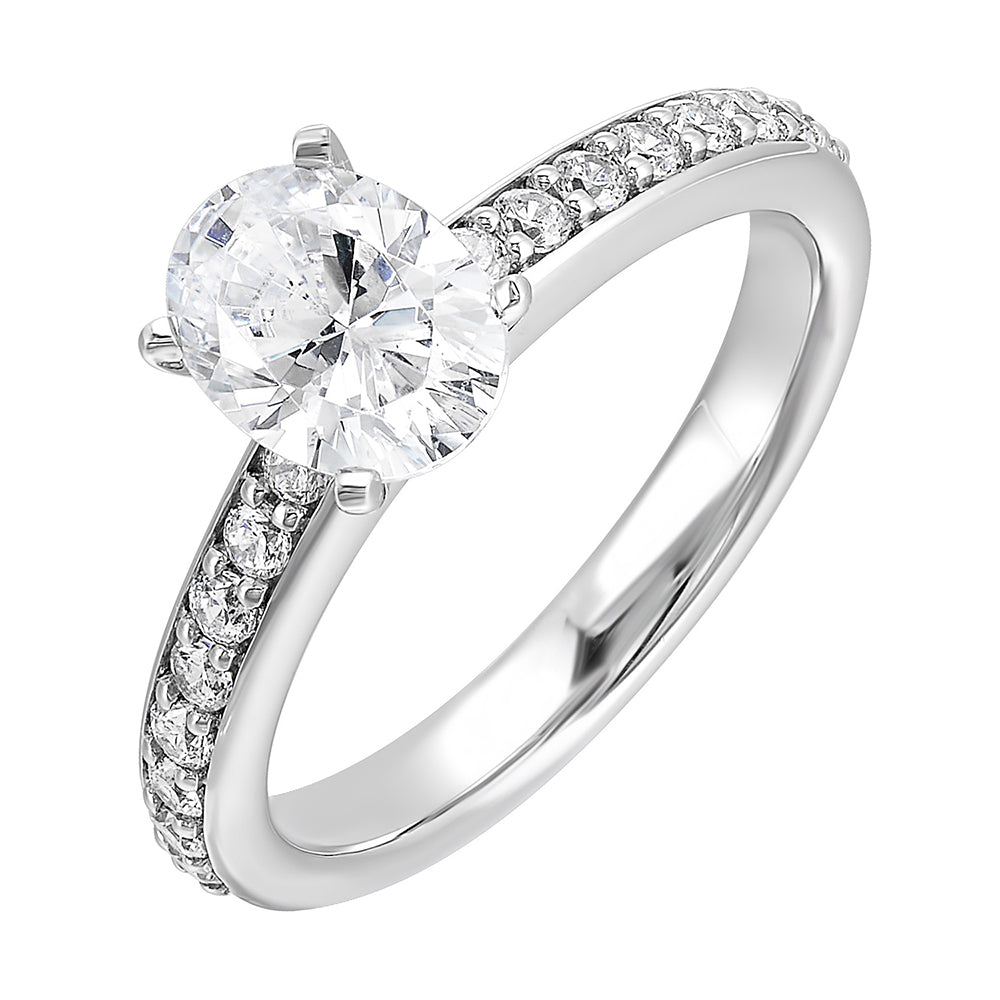 Sleek and beautiful,  this diamond engagement ring set with pave diamonds complements the oval solitare.