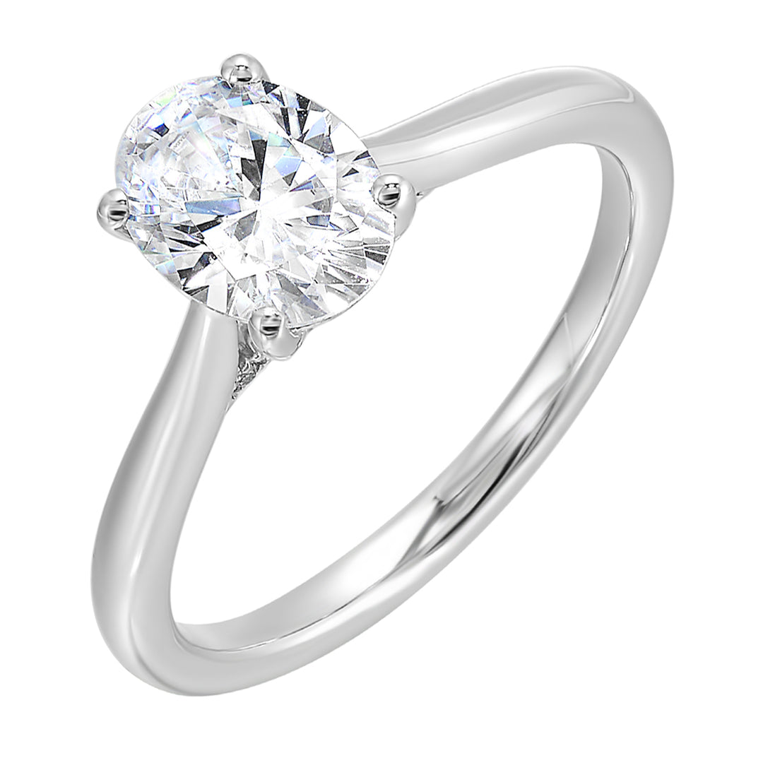 Effortless and classy this dazzling four prong oval solitaire ring features a clean,  classic look with a sleek band.