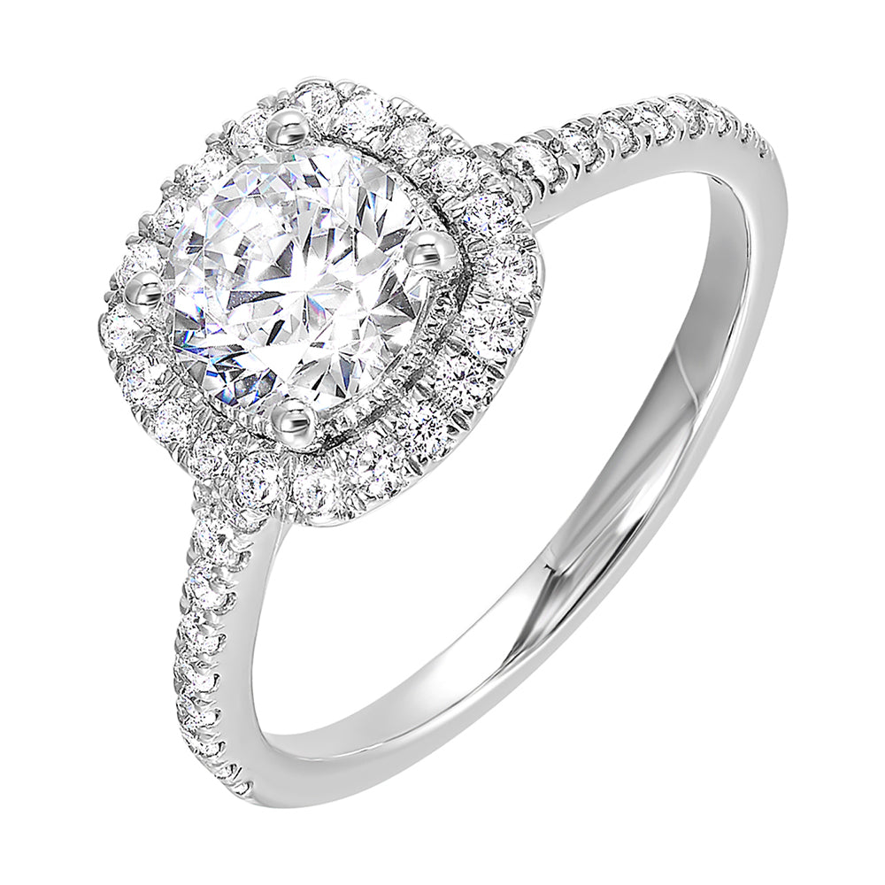 Sparkling cushion halo features beautiful set pav? diamonds that encircle the center solitare and adorn the band.