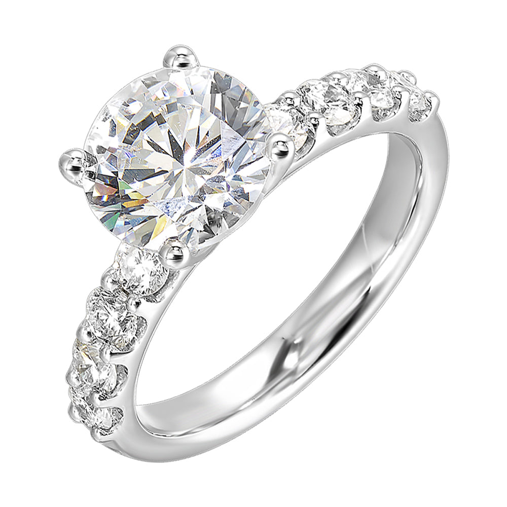 Bigger round diamonds rest on either side of this solitare engagement ring,  creating a modern yet timeless look.