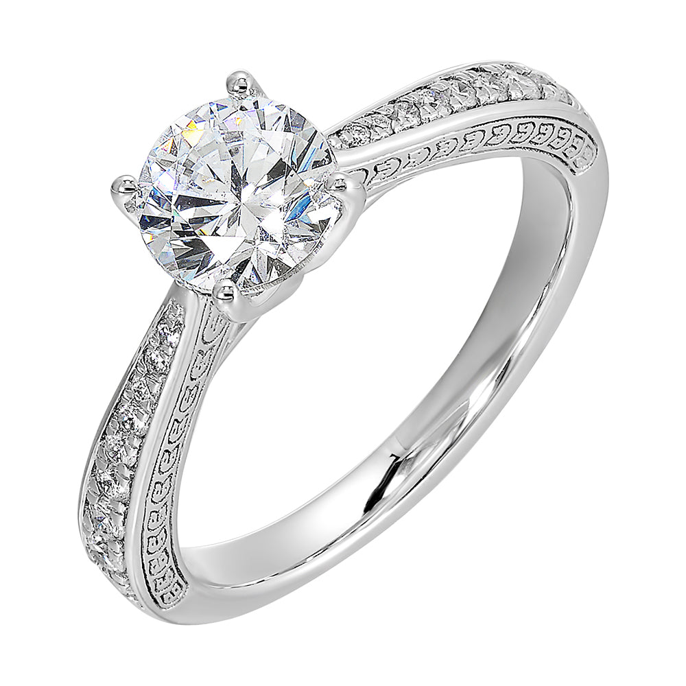 This classic solitare four prong diamond engagement ring features a reverse pave tapered shank accented with front details.