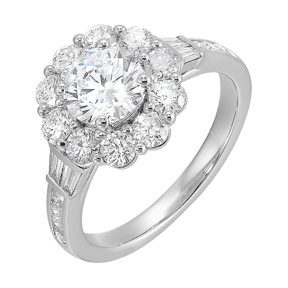 Elegant and romantic,  this engagement ring highlights a floral inspired halo followed by a tapered shank of baugette and round diamonds.