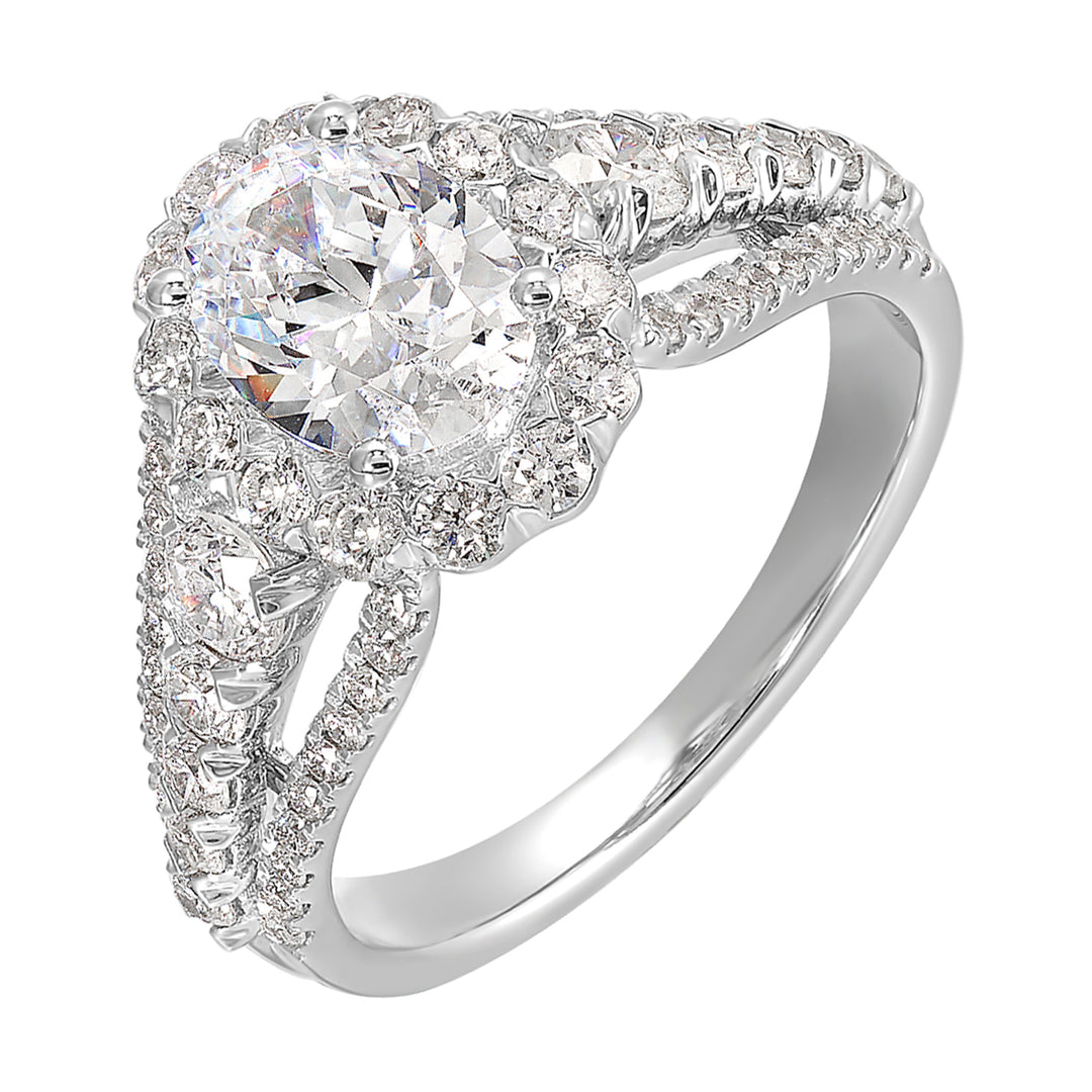 A dazzling broad ring with tapered shank consisting of bigger diamonds in the halo and center row complements her modern look.