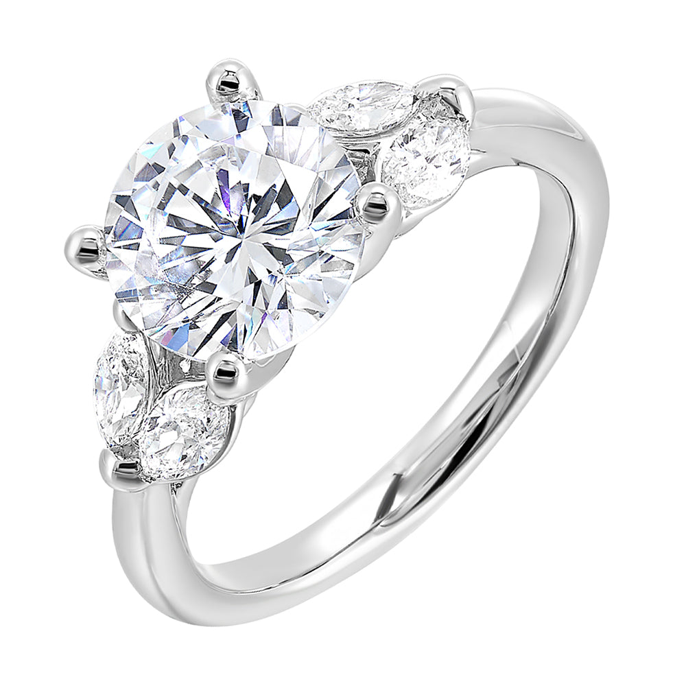 Contemporary style engagement ring features marquise set diamond on the band shoulder highlighting the center solitare.