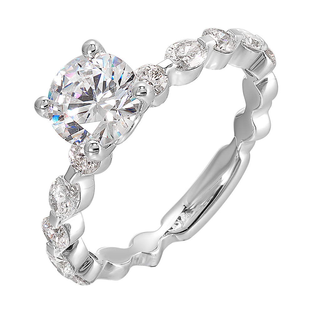 This trendy engagement ring features single prong diamonds set along the shank with stunning solitare in center.