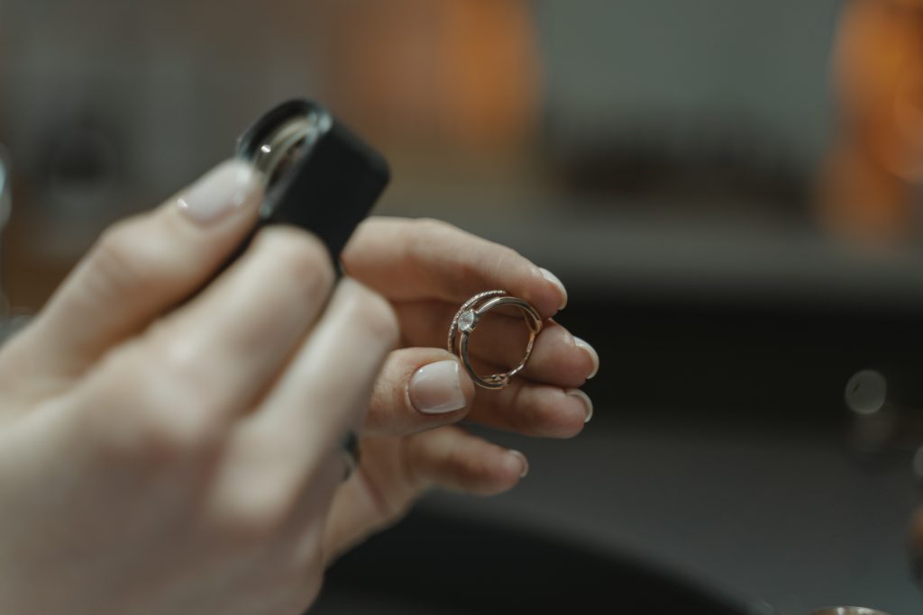 jeweler observing diamond ring