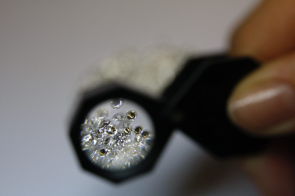 looking at diamonds through a magnifying glass